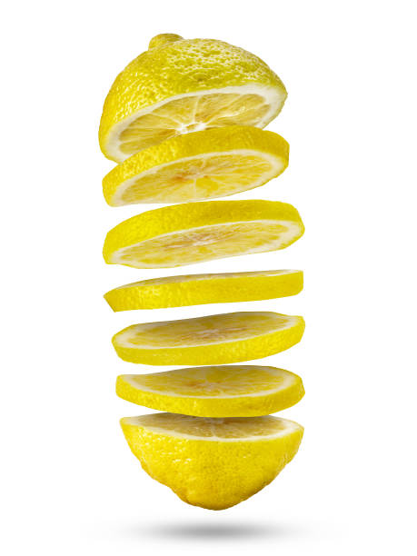 istock Sliced lemon flying in the air isolated on white. 1281991060