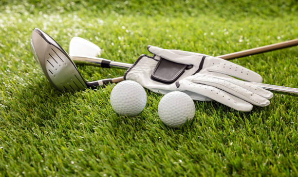 istock Golf equipment on green grass golf course, close up view. 1281992307