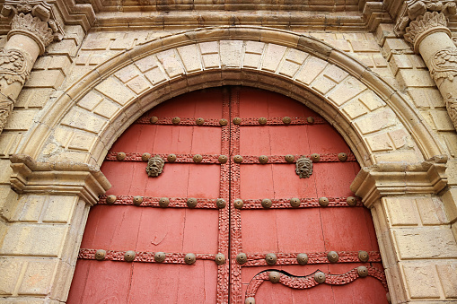 The Ornate Red Colored Wooden Door of Basilica of San Francisco, a Historic Baroque Church in La Paz, Historical Place in Bolivia