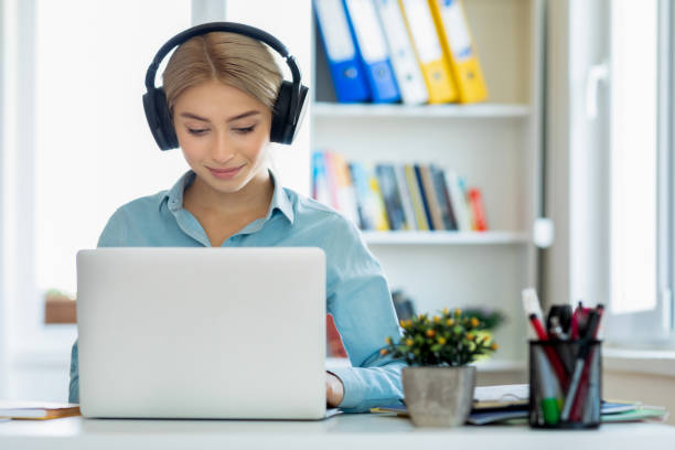 istock Young woman sit at desk at home 1281998637