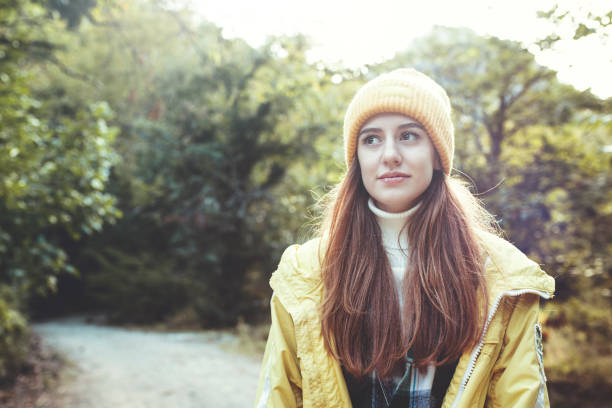 istock Young woman enjoying nature in green forest 1281999598