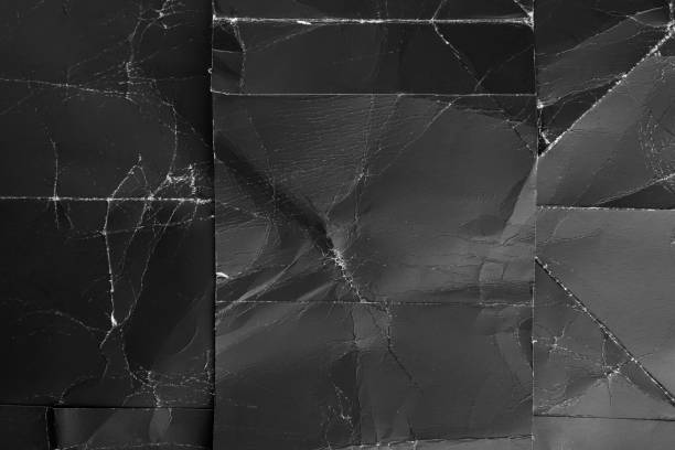 istock Black damaged old paper. Abstract dark natural pattern. 1281999716
