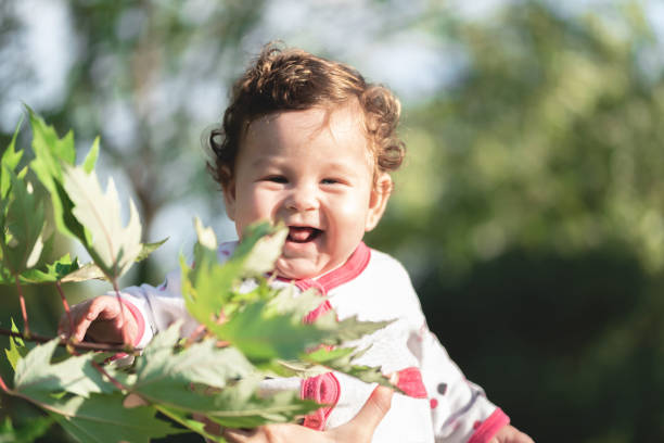 Cute baby girl having fun at park