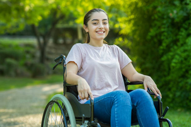 istock Disabled young woman in a park 1282003151