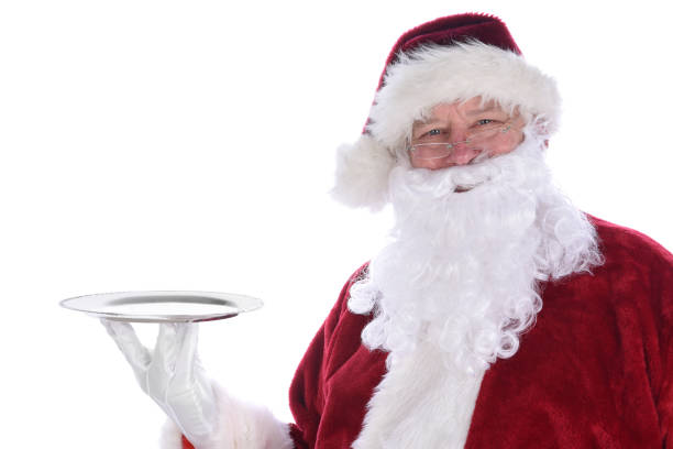 Santa Claus holding an empty silver platter isolated on white. Santa Claus holding an empty silver platter isolated on white. silver platter stock pictures, royalty-free photos & images