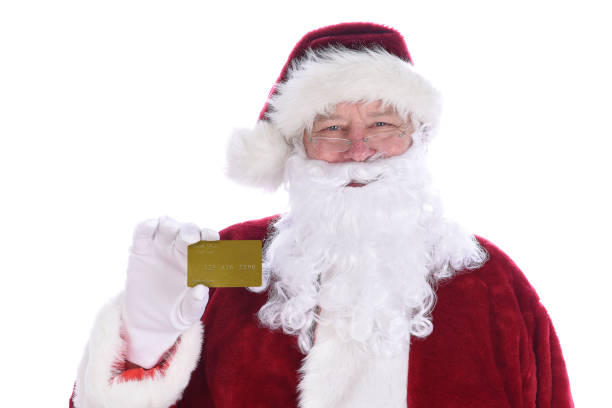 papai noel segurando seu cartão de crédito noth pole gold pessoal, isolado em branco. - 5611 - fotografias e filmes do acervo