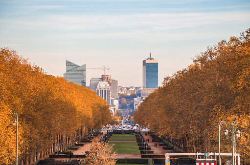 Modern buildings in the city contrasting with the vegetation of parks and gardens in the city of Brussels, image at sunset. Belgium