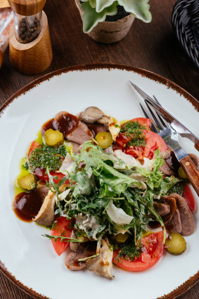 istock warm salad with beef and garlic sauce 1282005835