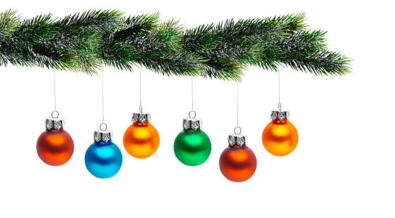 Colorful Christmas balls on a fir branch