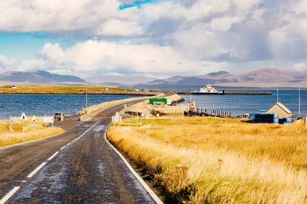 Road leading to the causeway linking the island of Berneray to North Uist, part of the Outer Hebrides of Scotland.