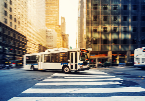 New York, New York, USA - August 10, 2022: M1 Bus on Fifth Avenue. People can be seen.