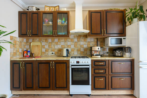 Kitchen set for dark wood in a standard apartment stock photo