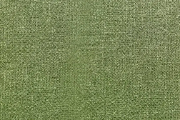Green fabric texture surface for interior wall design. Olive color seamless textile for nature of peace feeling for architecture or construction of hotel or fancy restaurant.