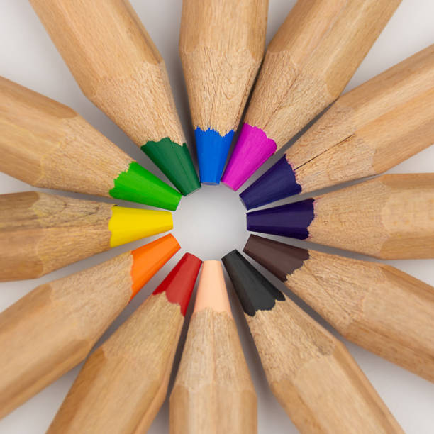 istock Set of wooden colored pencils arranged in a circle on light background 1282019727