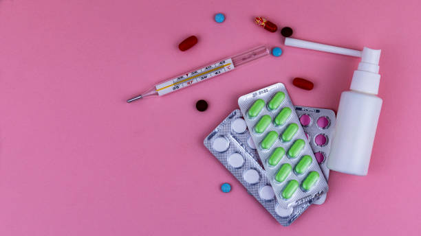 istock medical instruments and medicines on a pink background, isolates 1282020946