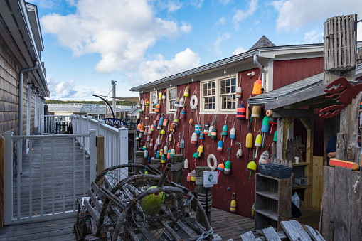 Lobster traps and buoys on the dock in Bar Harbor, Maine