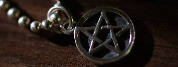 istock Silver Pentagram charm old necklace  dark web banner 1282021952