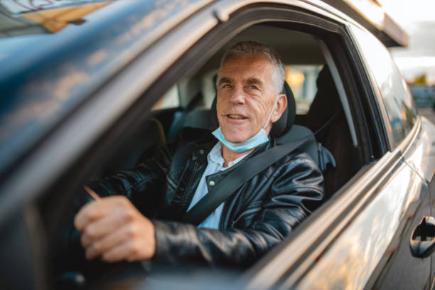 istock Smiling Senior Man at Drive Thru Medical Test Site 1282026210