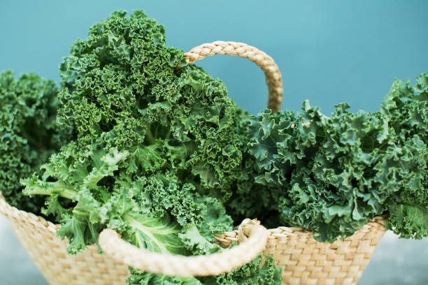 istock Green kale salad in straw bag 1282026401