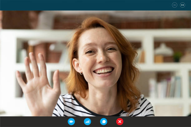 istock Smiling woman wave to camera talking on video call 1282034982