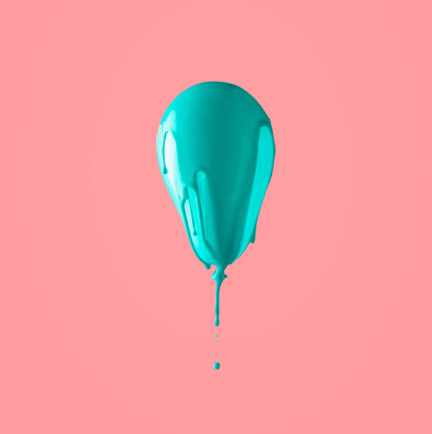 istock Blue ballon covered in turquoise paint on pastel pink background. 1282035068