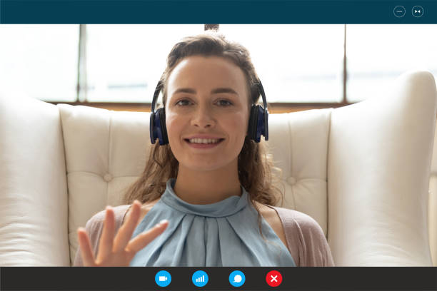 istock Smiling woman in headphone shave webcam lesson at home 1282036370
