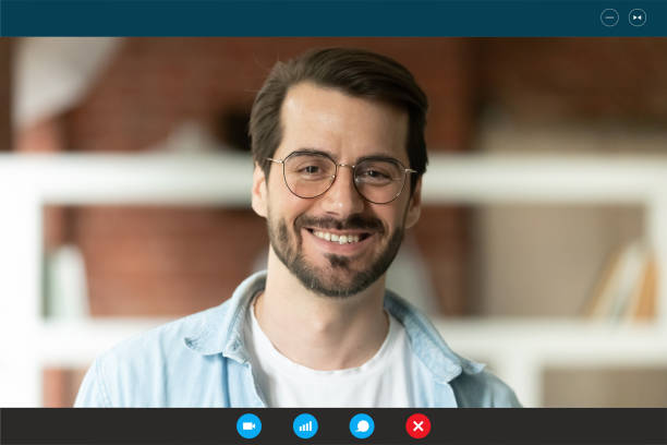 istock Screen view of smiling man talk on video call 1282036378