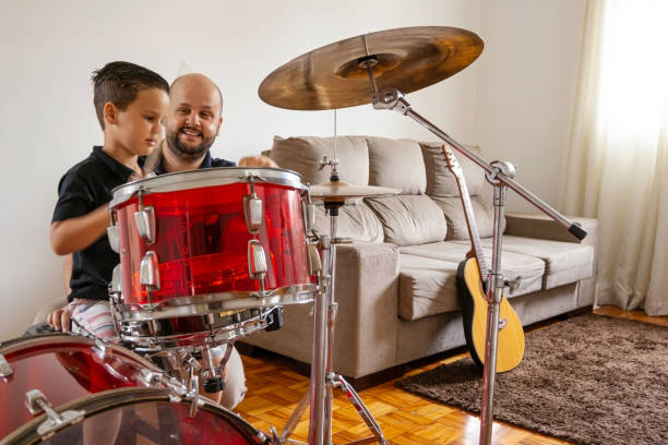 istock Father and son playing music at home. 1282039162