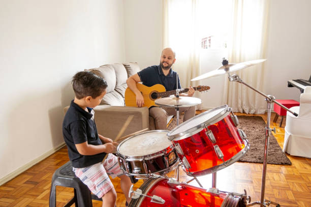 istock Father and son playing music at home. 1282039239