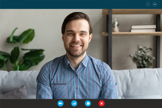 istock Screen view of smiling man talk on video call 1282039993