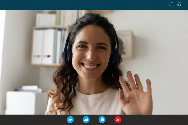 istock Screen view of smiling woman wave talking online 1282040004