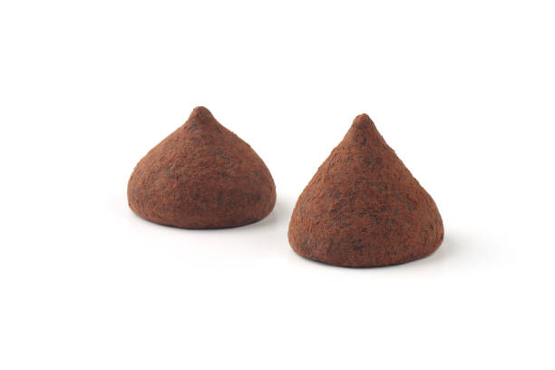 two truffle candies on a white background