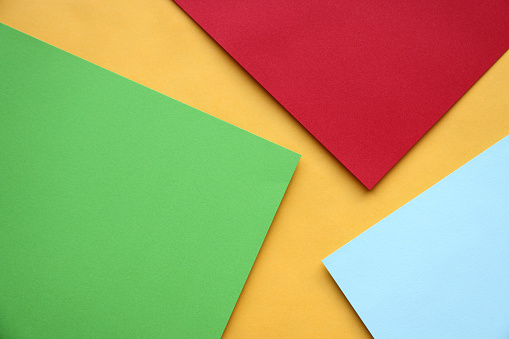 The picture shows colorful sheets of paper for scrapbooking of schoolchildren on a white background.