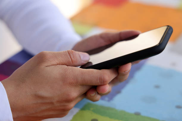 istock Woman hand typing on smartphone. 1282046940