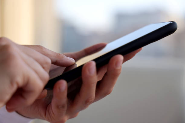istock Woman hand typing on smartphone. 1282047457