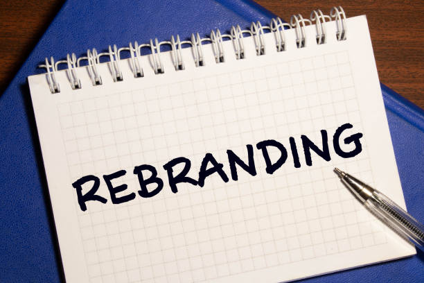 istock Rebranding written in a note. Rebrand marketing concept. 1282049921