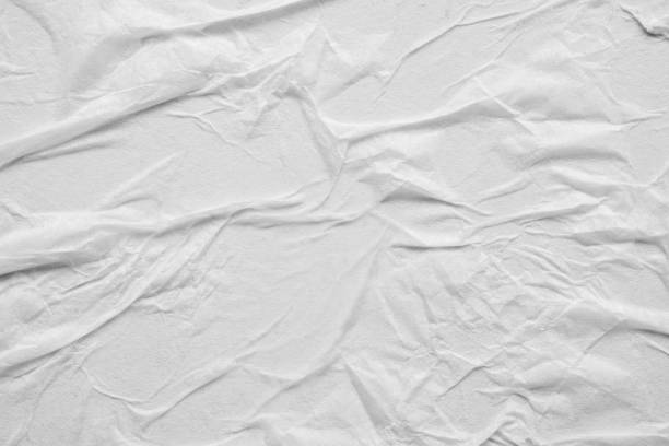 istock Blank white crumpled and creased paper poster texture background 1282054097