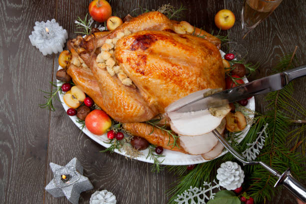 istock Carving Roasted Christmas Turkey with Grab Apples 1282056830