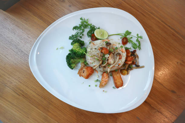 istock stir fried rice with fried salmon and mushroom 1282071225