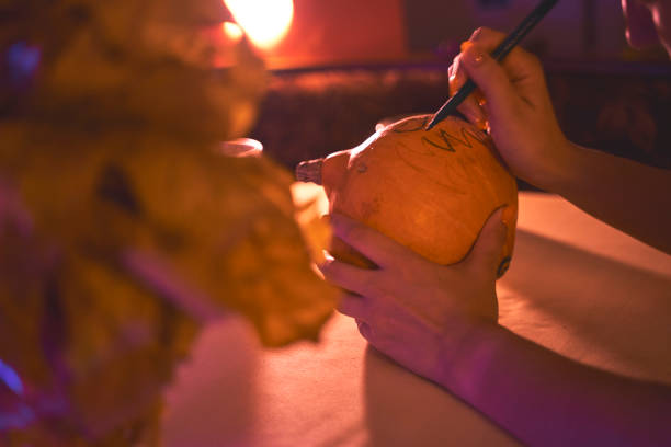 istock preparation for the Halloween holiday, making from pumpkin 1282072731