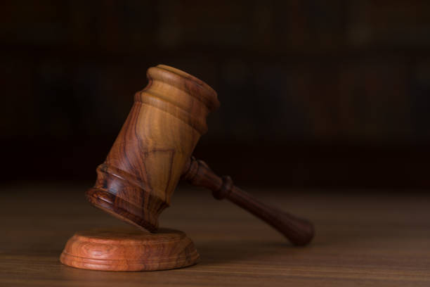 Wooden judges gavel on a wooden table.Law and justice concept, close up