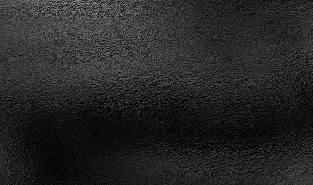 istock Background texture of shiny black metal foil 1282079377