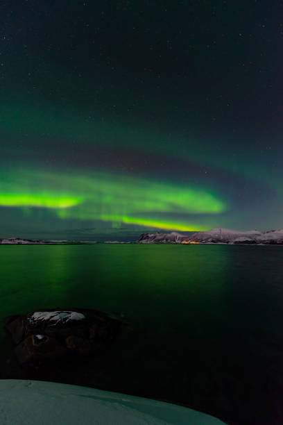 istock Aurora Northern Polar light in night sky over Northern Norway 1282085482