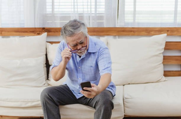 istock Asian senior fatigue man taking off glasses during using smartphone 1282086143