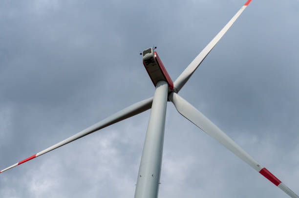 istock rotor blades of a wind turbine at cloudy sky 1282091614