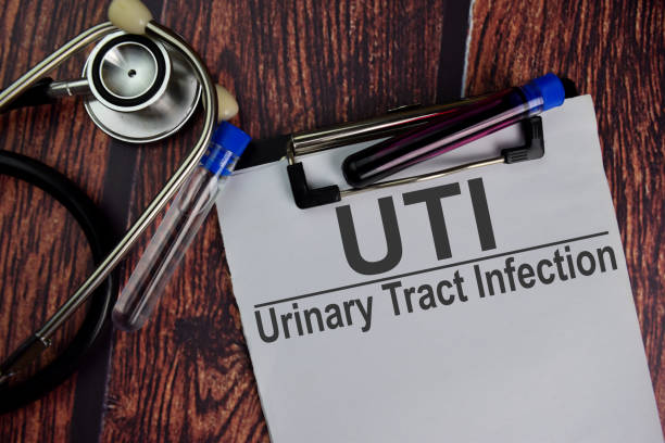 istock UTI - Urinary Tract Infection text write on a paperwork isolated on office desk. Healthcare/Medical concept 1282091704