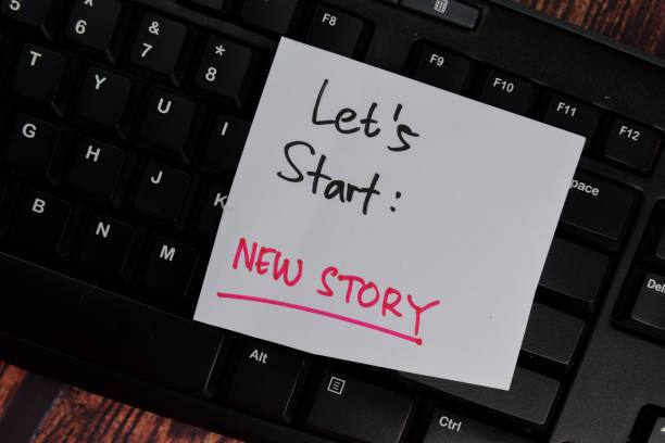istock Let's Start - New Story text on sticky notes with office desk. 1282091749