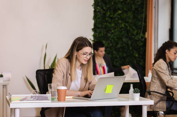istock Portrait of a young female freelancer working in an office while sitting at a table. 1282094214