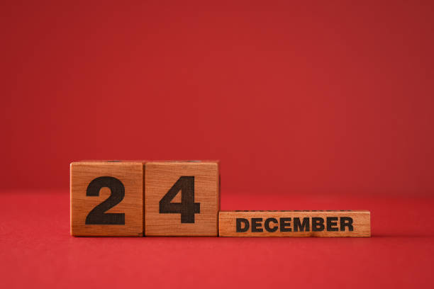 istock Christmas eve with calendar blocks on a red background 1282095493