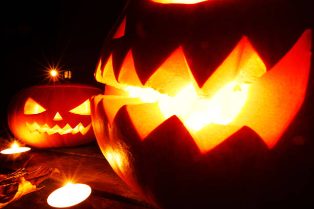 istock Halloween pumpkins and candles 1282097836